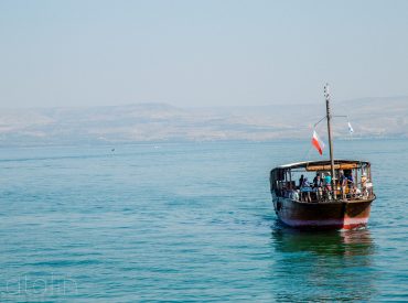 people riding on boat on sea during daytime