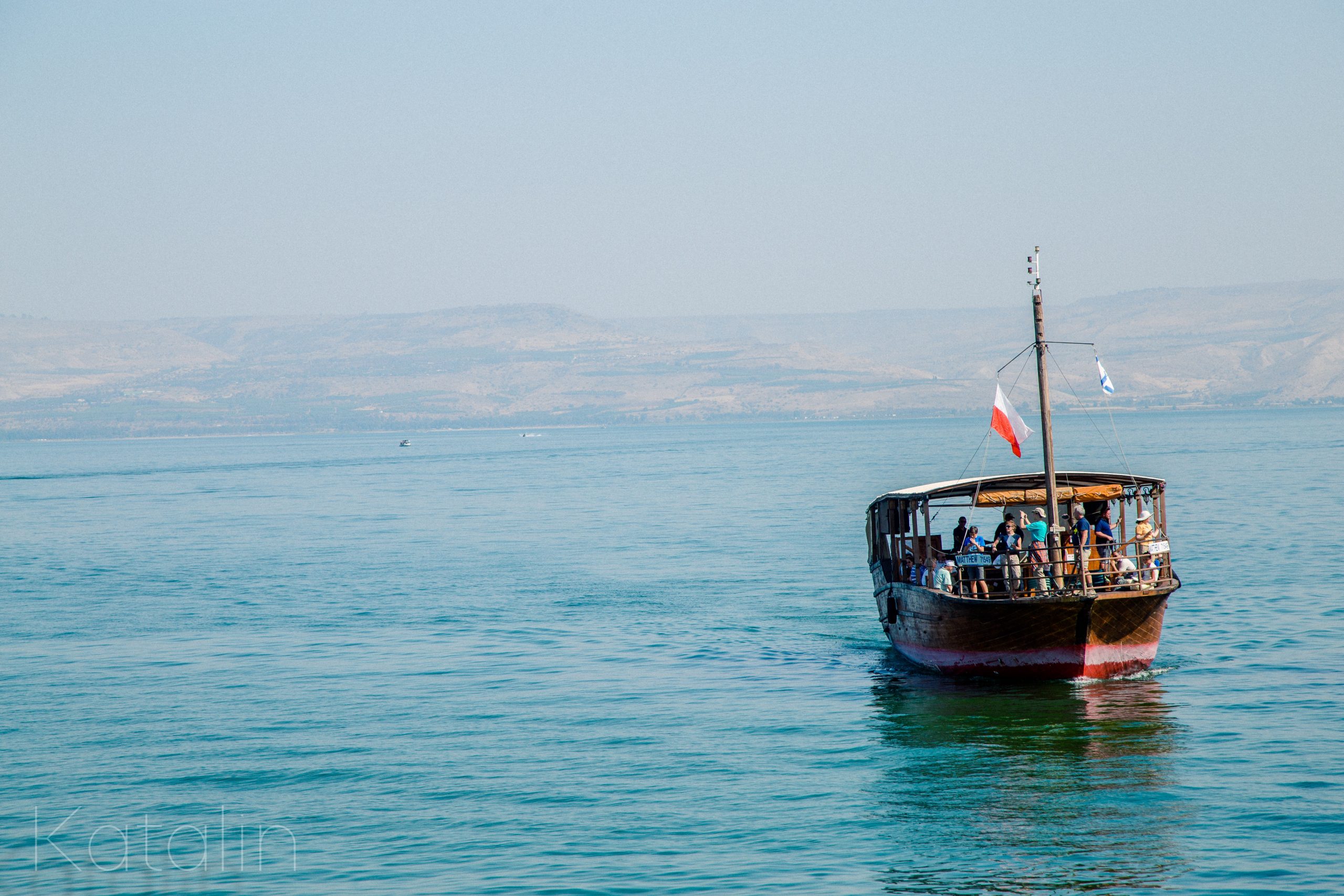 people riding on boat on sea during daytime