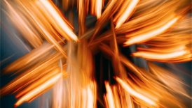 A blurry photo of a cross made of wood