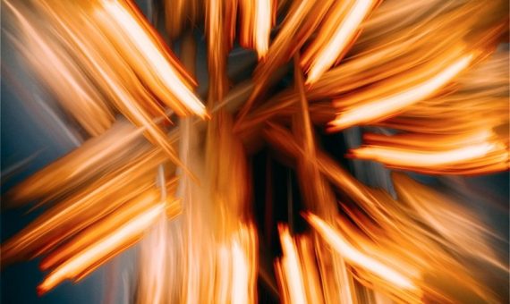 A blurry photo of a cross made of wood