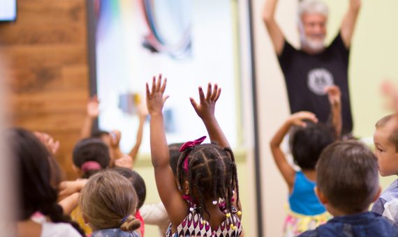 children lifting hands