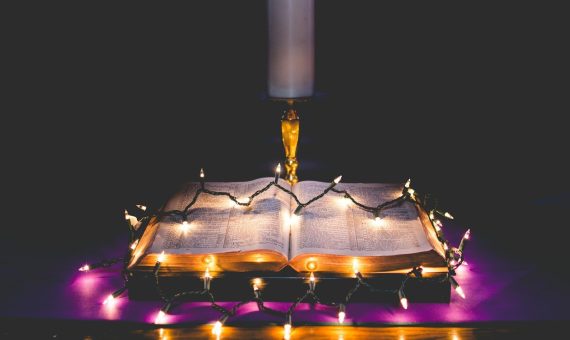 turned on string lights on top of opened page books